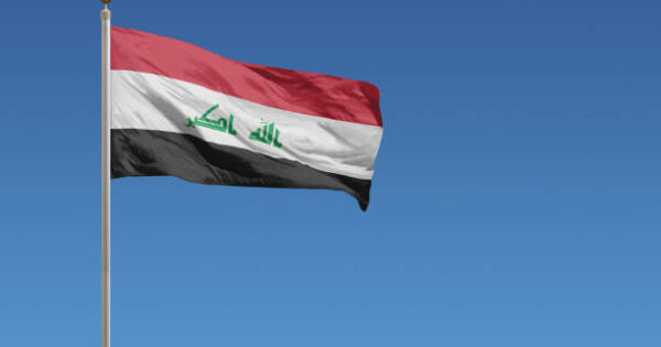 image-flag-of-iraq-in-front-of-a-clear-blue-sky