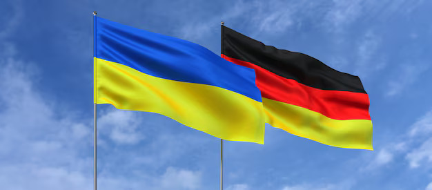 Almaniya ukraynalı qaçqınlar üçün administrasiya yaradacaq 1 image-flags-ukraine-germany-flagpoles-center-flags-sky-background-place-text-ukrainian-german-3d-illustration_630687-1854